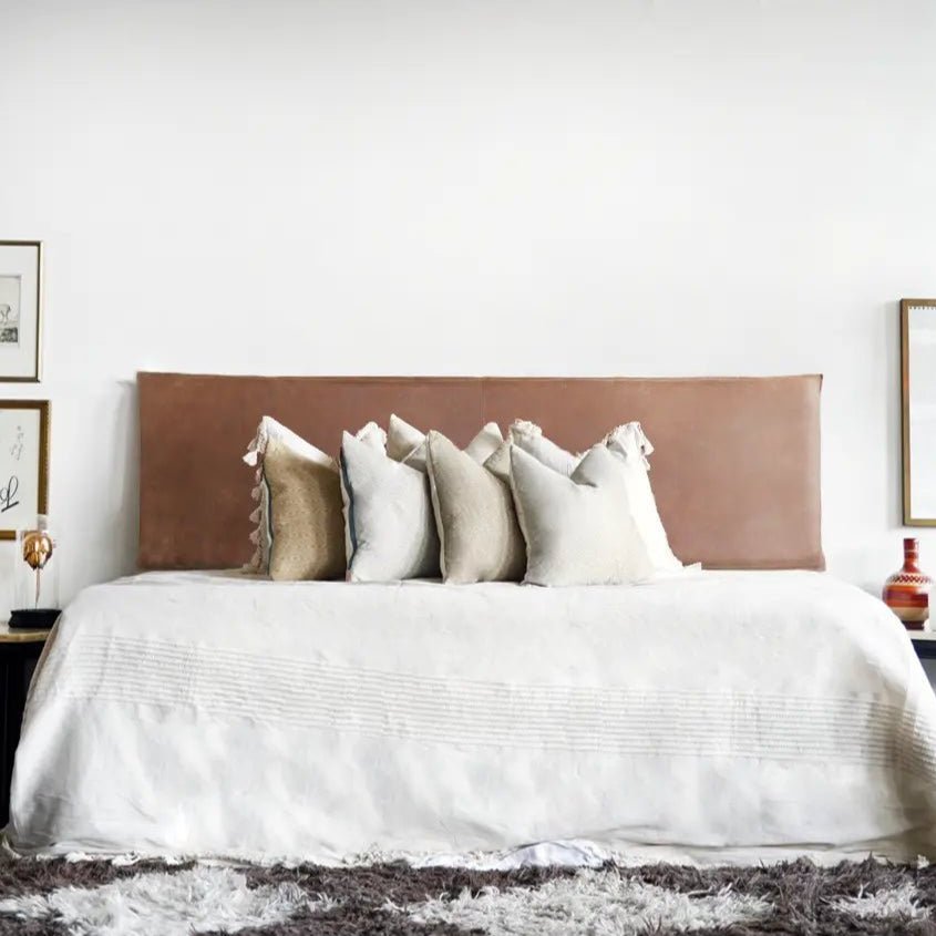 Aged Tan Leather Wall - Mount Headboard - headboardLEATHERShopify CollectiveHUNTEDFOX - Light Brown Leather Headboard styled in boho bedroom with white pillows