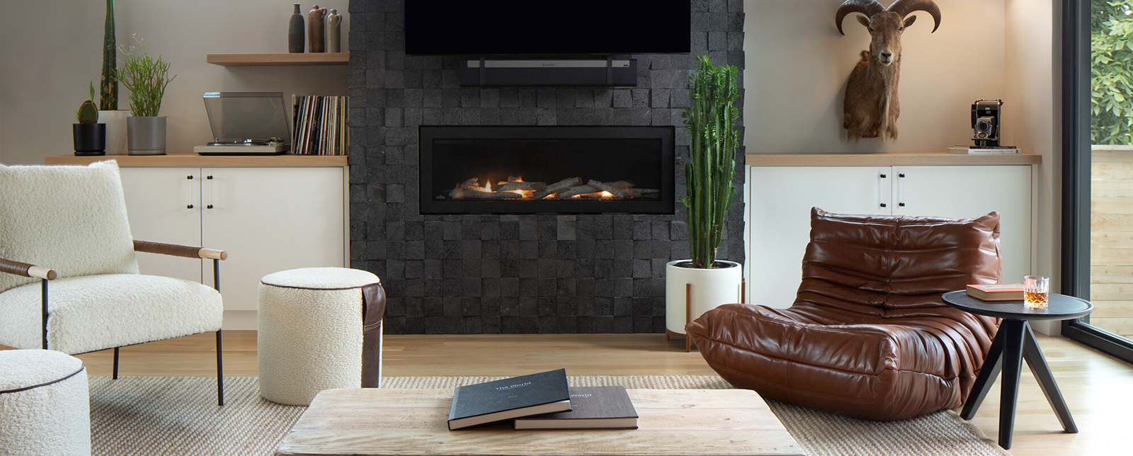 living room with white chair and ottoman in front of record player