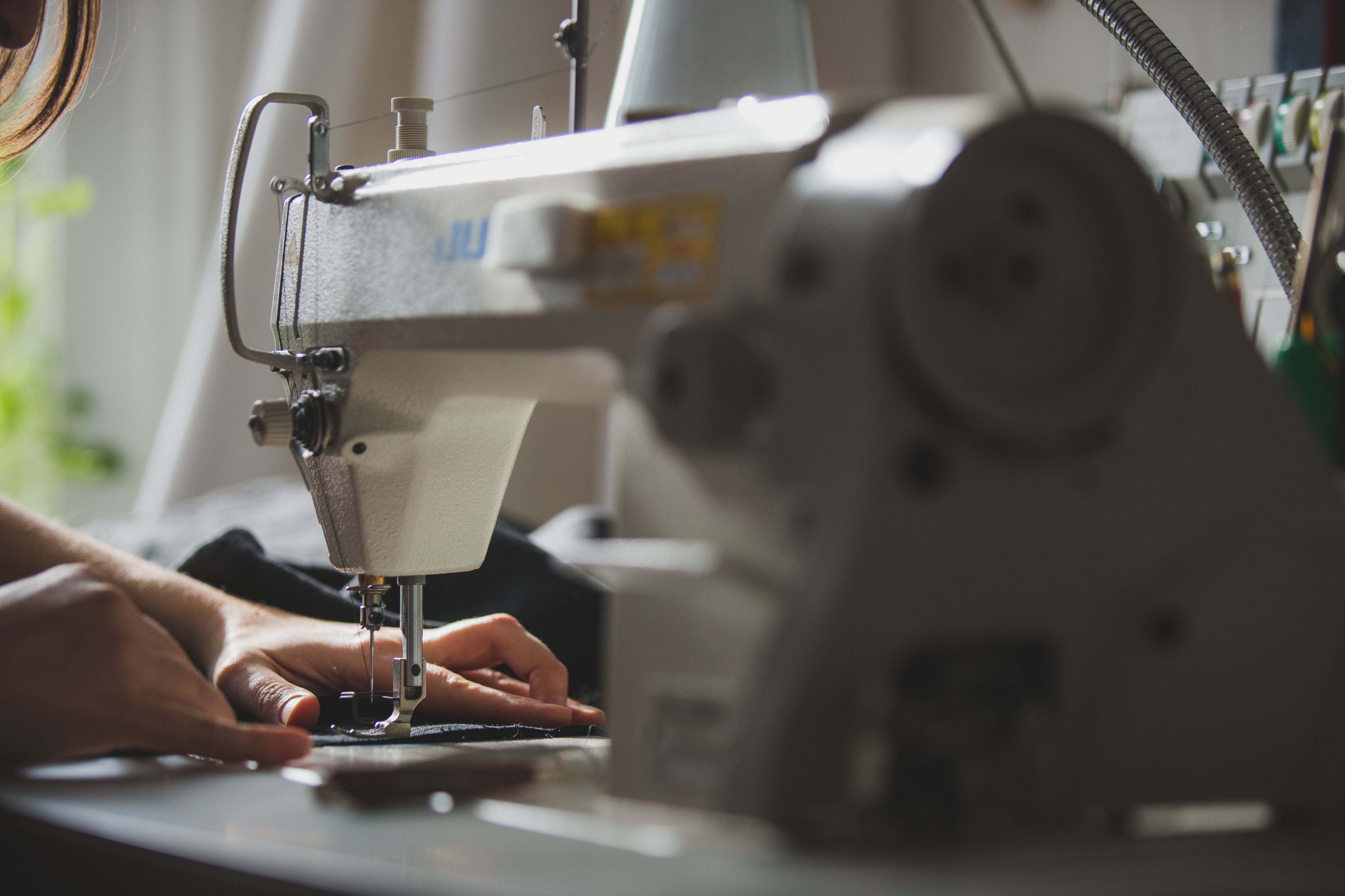 person-using-sewing-machine.jpg