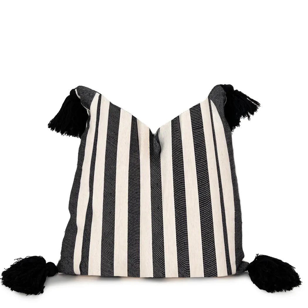 Black and White Striped Pillow With Pom Poms