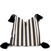 Black and White Striped Pillow With Pom Poms