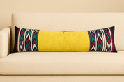 Yellow Long Lumbar Pillow - BAJA CHICbody pillowDESIGNERHUNTEDFOX - Bright yellow leather long lumbar pillow with colorful tribal zigzag embroidery, styled on a cream sofa by HUNTEDFOX