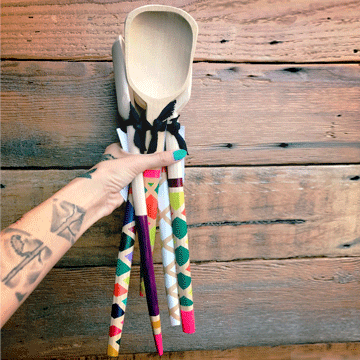 colorful spoons in hand