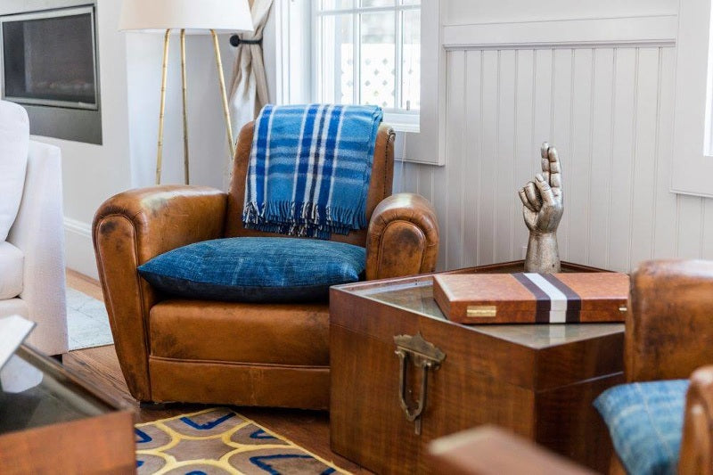 vintage leather chair and african indigo pillows
