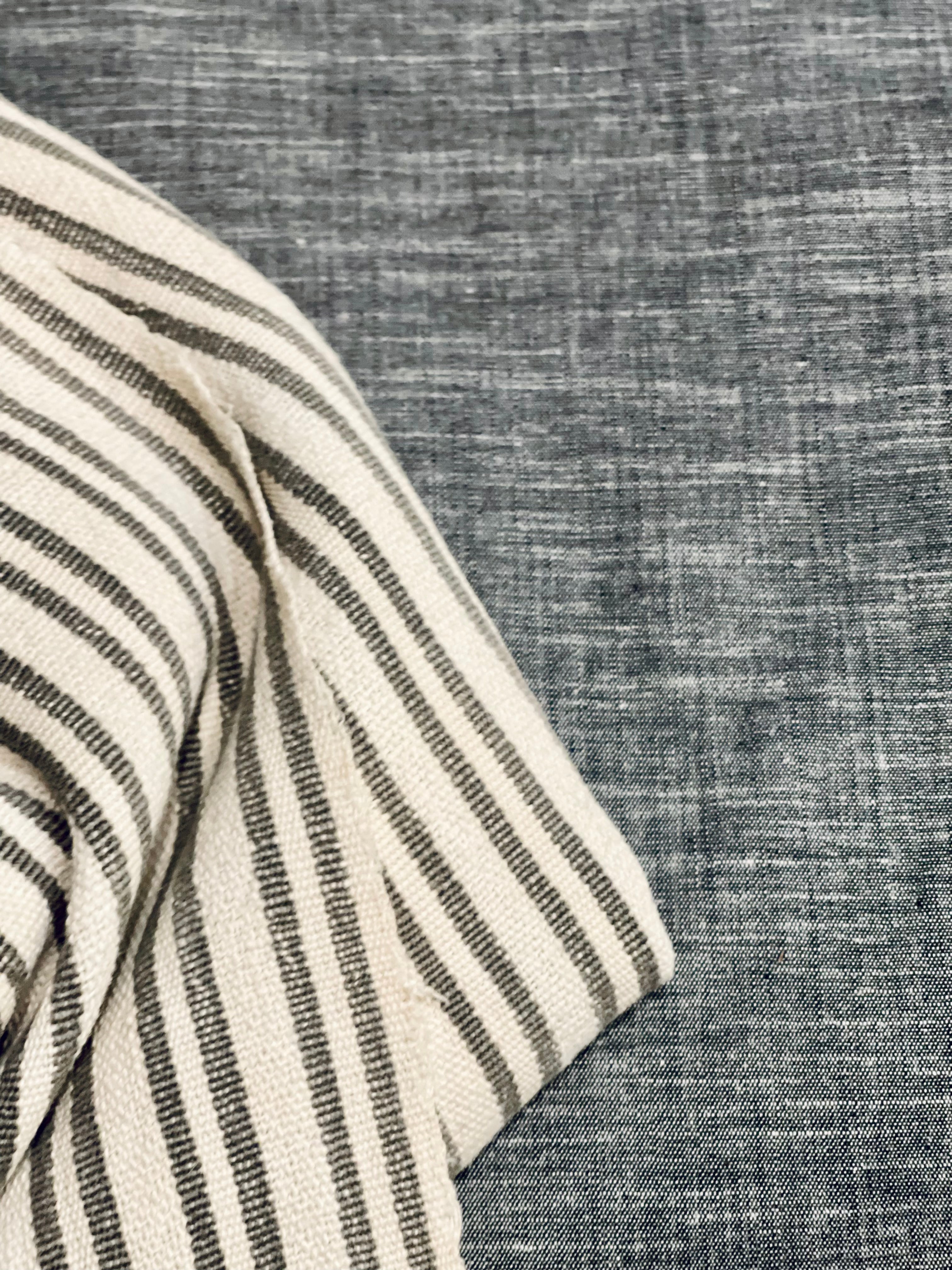 grey striped pillow with grey chambray back