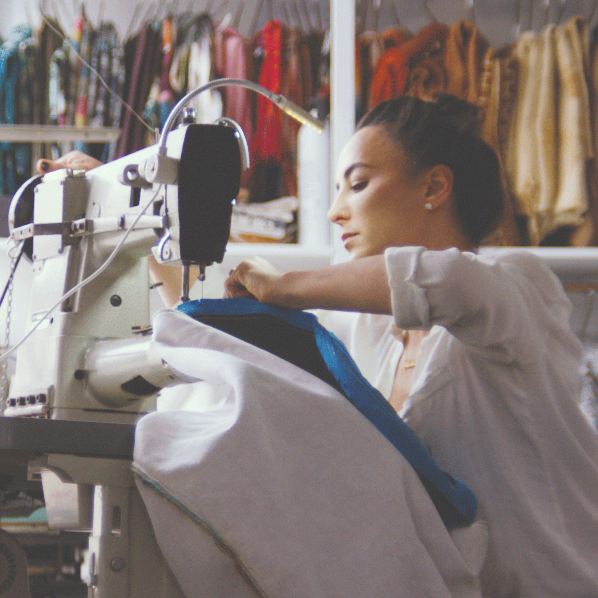 Moana Dixon, owner of the HuntedFox, sewing a handcrafted pouf in the studio.