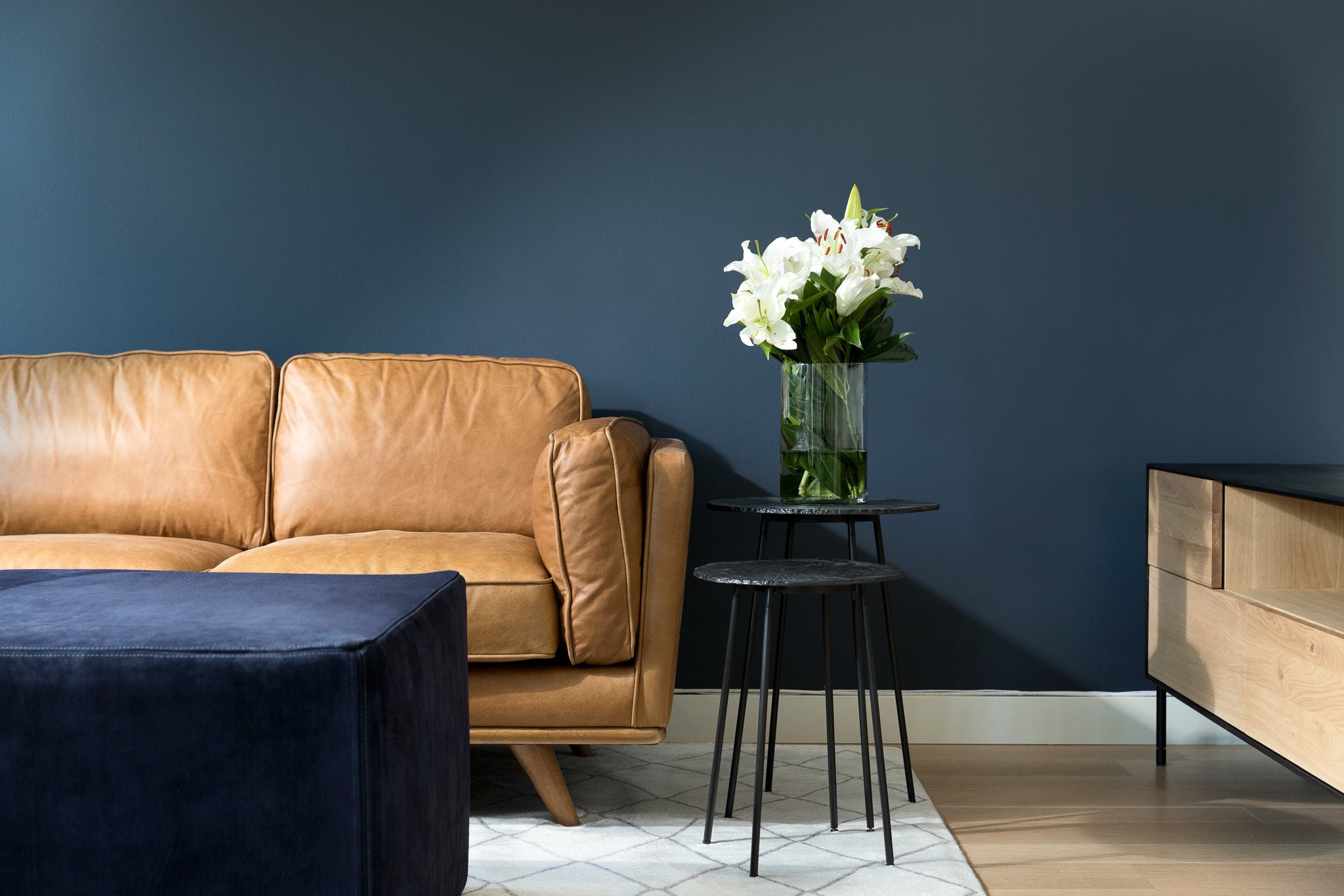 blue suede ottoman by HINTEDFOX in living room setting