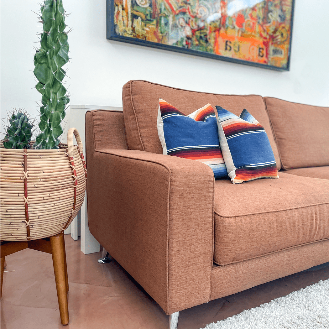 Blue Striped Vintage Saltillo Lumbar Pillow - BAJA CHICneed verificationrainbowHUNTEDFOX - Blue Striped Vintage Saltillo Lumbar Pillow - BAJA CHICrainbowHUNTEDFOX - serape - accent - pillow - on - brown sofa
