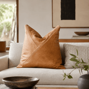 Classic Tan Leather Throw Pillows | Triangle Pattern - LEATHERLeather Pillowneed verificationHUNTEDFOX - Brown leather pillow on a beige sofa with a neutral color scheme