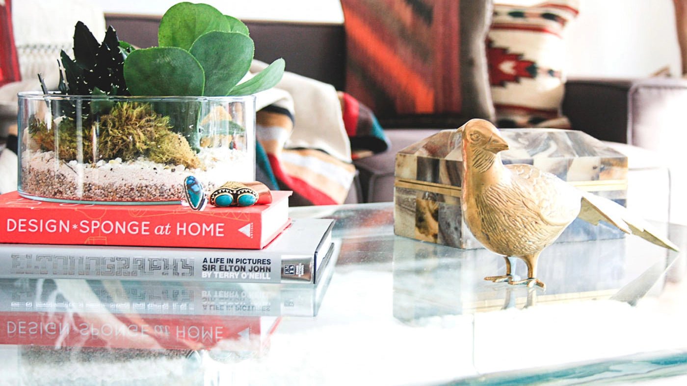 Vintage Brass Pheasant Figurine – Mid - Century Modern Decor - birdbird paperweightbrassHUNTEDFOX - Mid - century modern vintage brass pheasant statue on a glass table next to books
