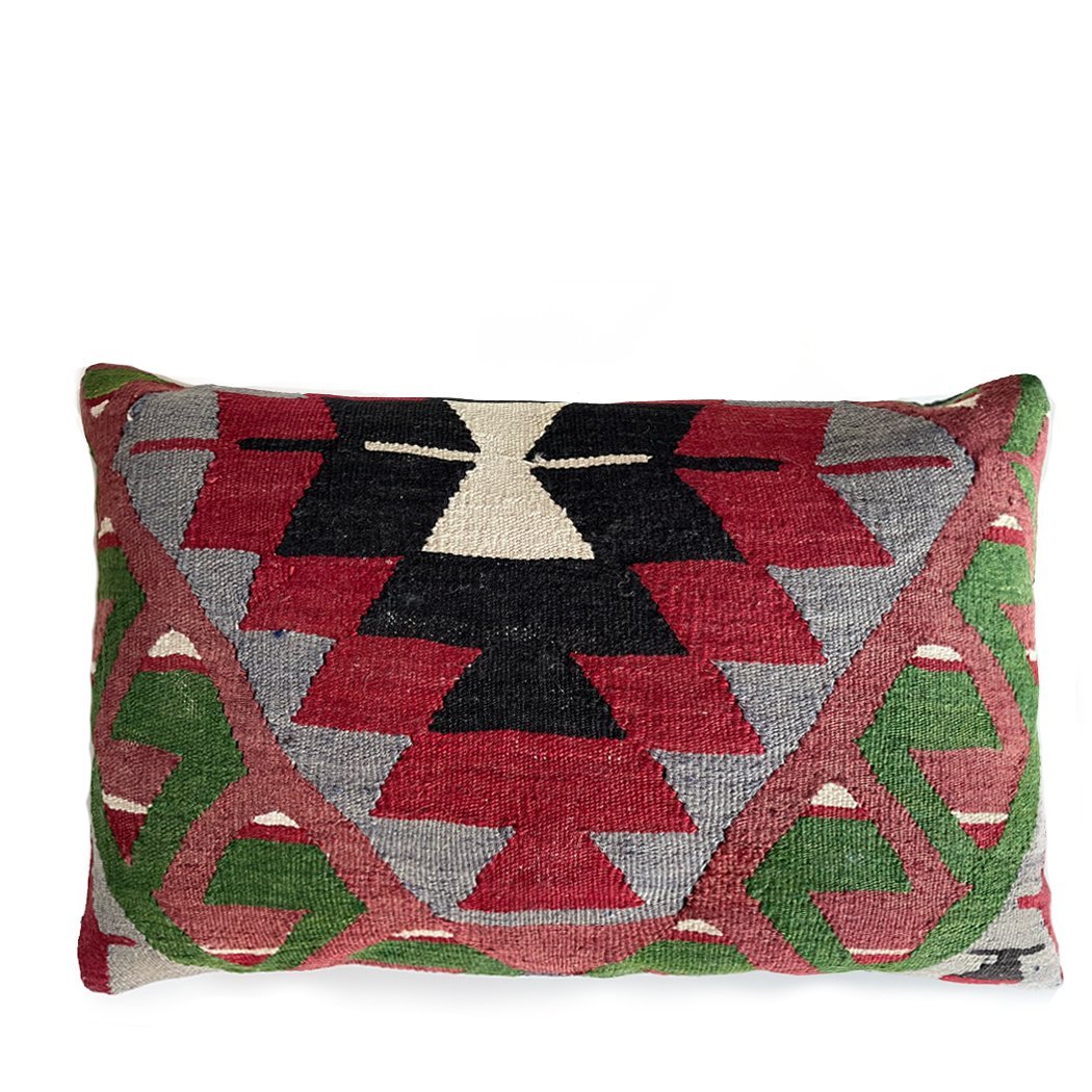 Vintage Turkish kilim lumbar pillow in red, black, and green with tribal geometric pattern