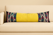 Yellow Long Lumbar Pillow - BAJA CHICbody pillowDESIGNERHUNTEDFOX - Bright yellow leather long lumbar pillow with colorful tribal zigzag embroidery, styled on a cream sofa by HUNTEDFOX